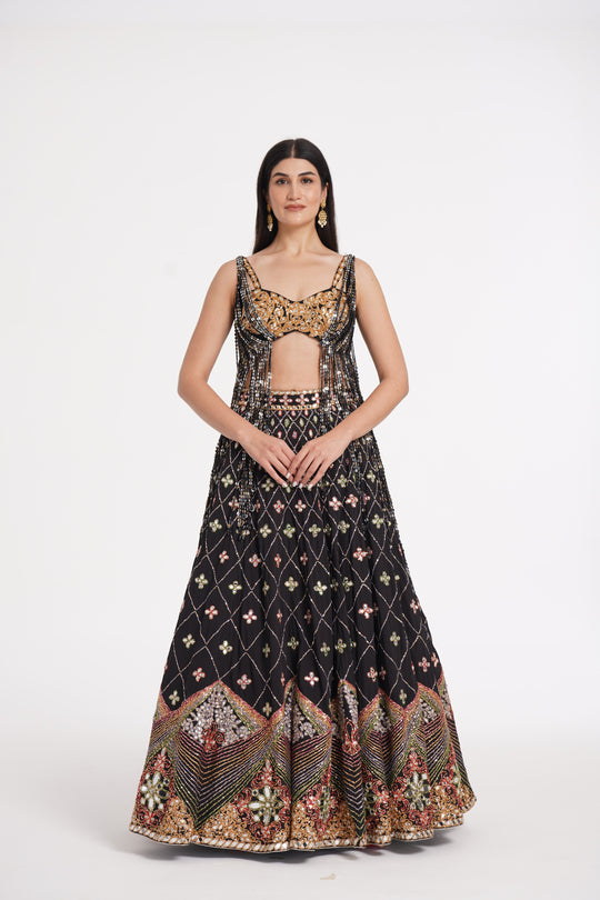 Abhinav Mishra - Matte black fringes blouse and skirt embellished using warm pastels