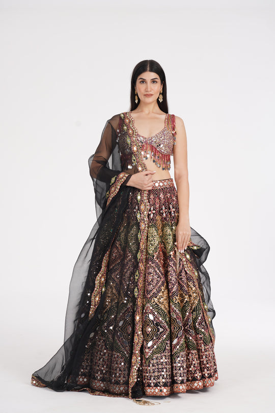 Abhinav Mishra - Matte black lehenga embellished using warm pastels