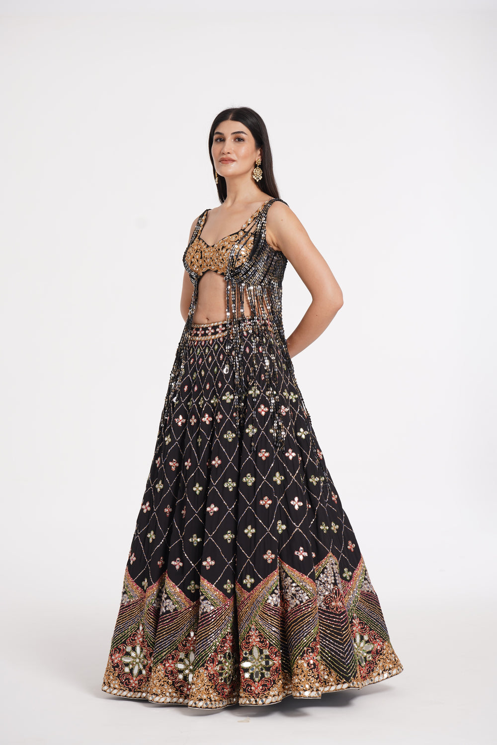 Abhinav Mishra - Matte black fringes blouse and skirt embellished using warm pastels