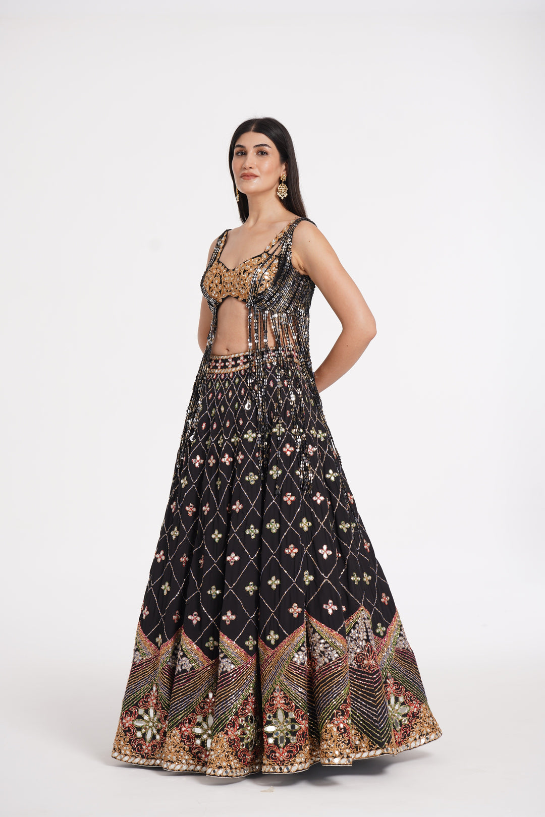 Abhinav Mishra - Matte black fringes blouse and skirt embellished using warm pastels