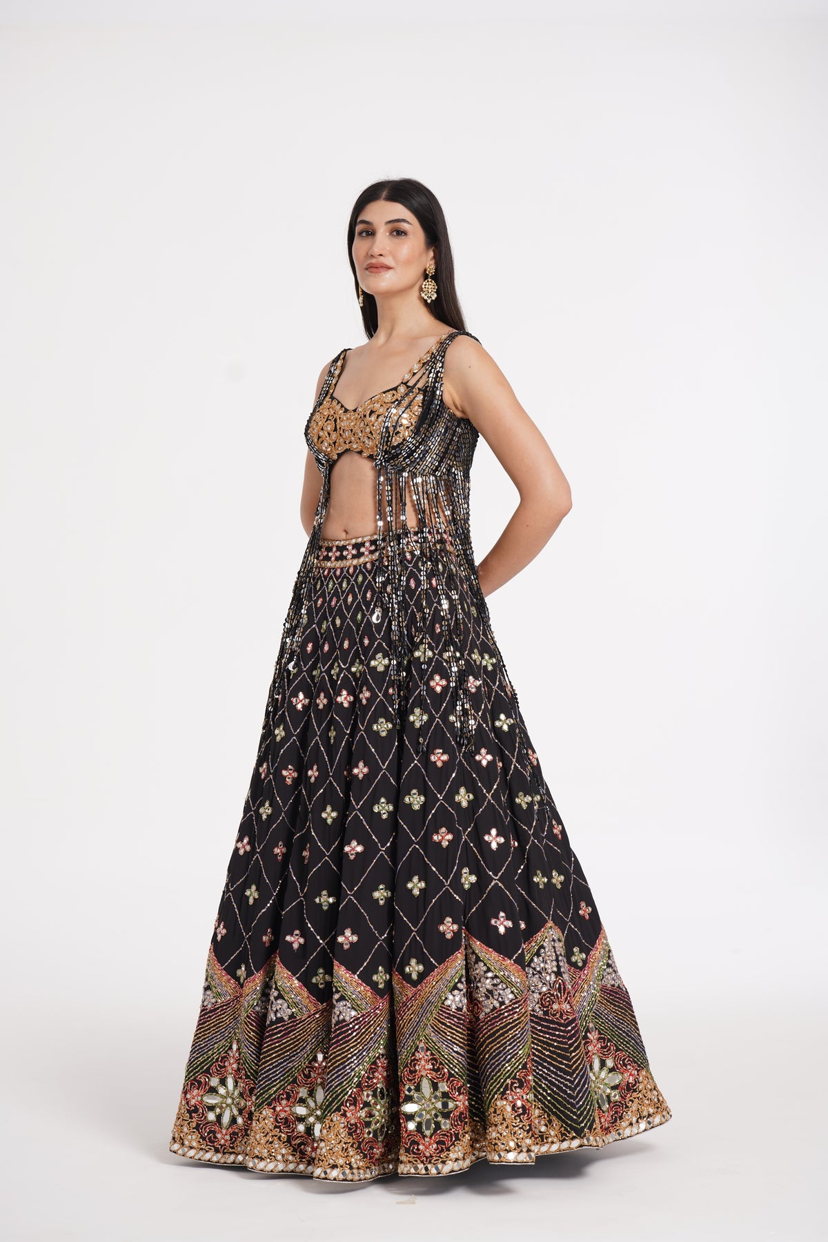 Abhinav Mishra - Matte black fringes blouse and skirt embellished using warm pastels