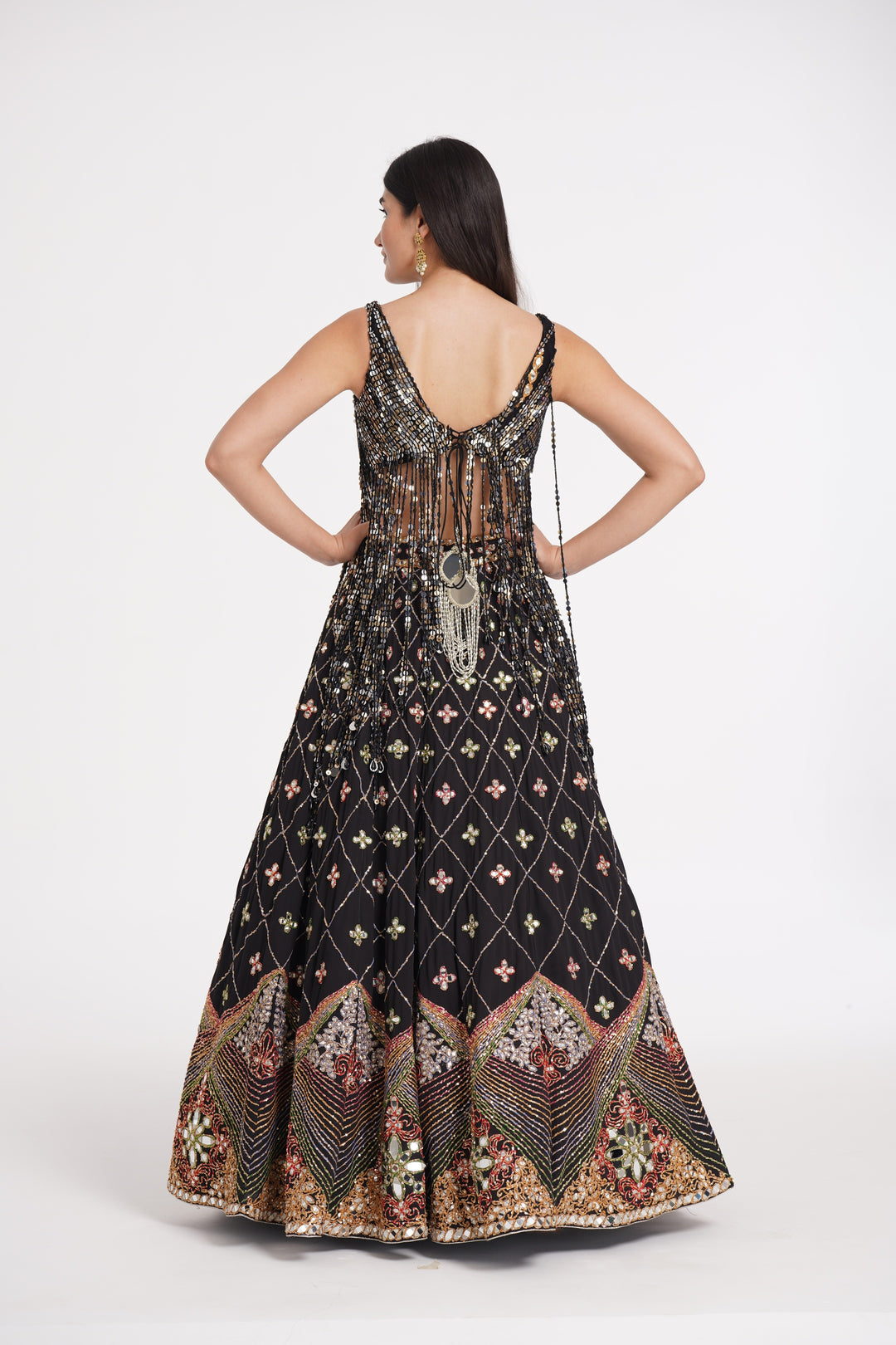 Abhinav Mishra - Matte black fringes blouse and skirt embellished using warm pastels