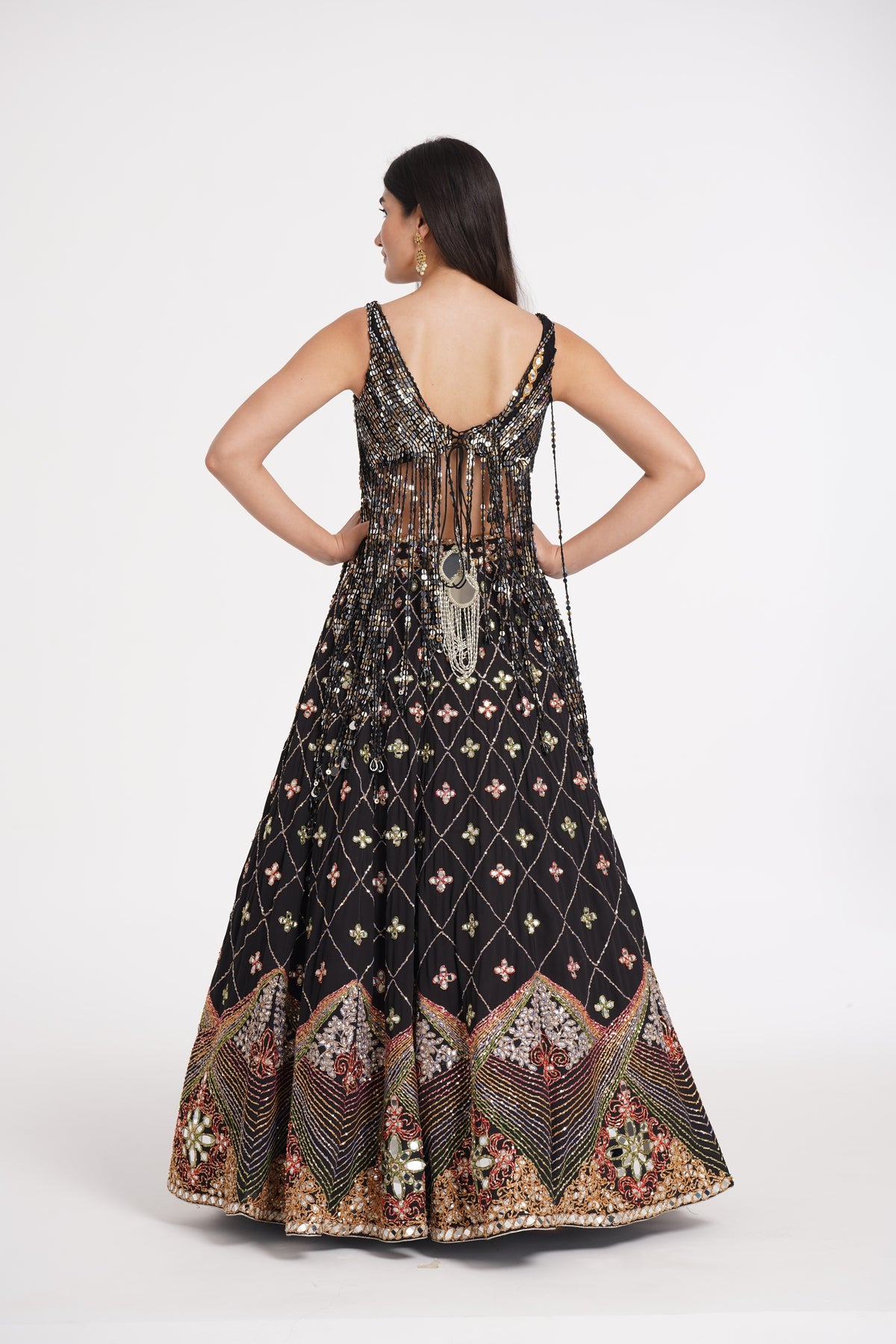 Abhinav Mishra - Matte black fringes blouse and skirt embellished using warm pastels