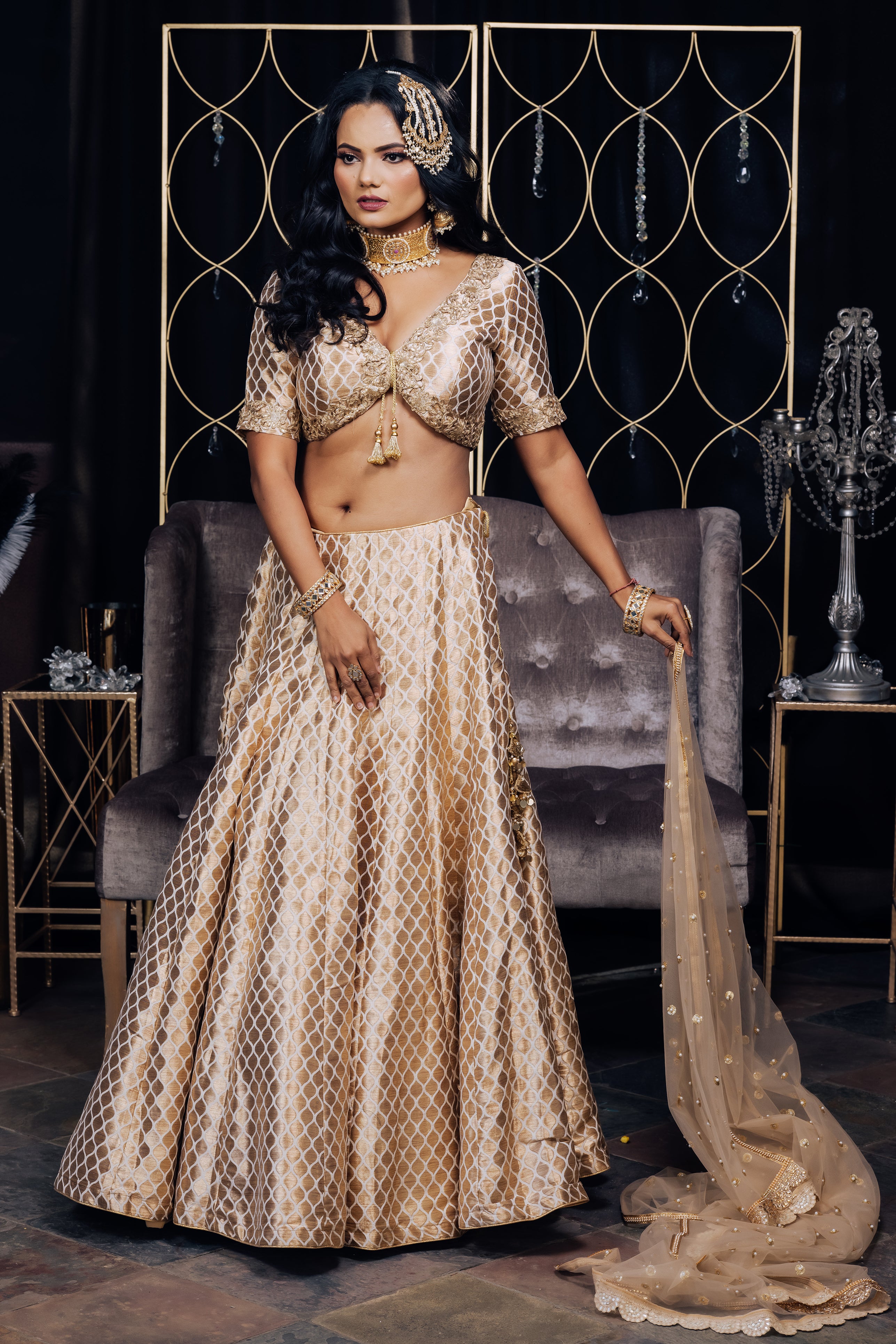 Aza - This light beige tiered lehenga by ace designer Manish Malhotra takes  the meaning of 'grand' to a whole new, glamorous level. An eloquent play of  fabrics, layers and tassels makes